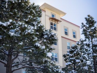 UCCS dorm with snowy pine trees