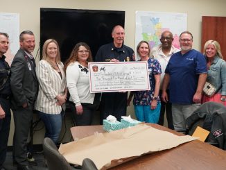 Steve Dubay with large check and others