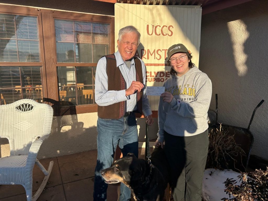 William Stanley and Zorro presenting the check for UCCS Farm