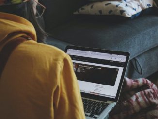Person typing on their laptop